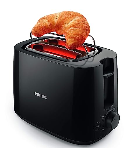 Philips HD2583/90 black 2-slot toaster with a croissant resting on the bun warming rack