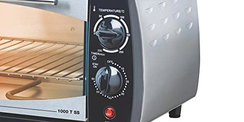 Close-up of Bajaj 1000 T SS temperature and timer knobs and red power indicator