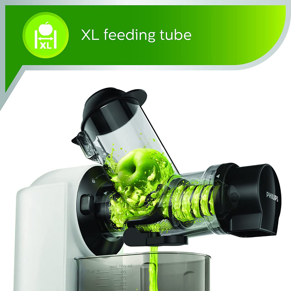 Close-up of Philips HR1887/81 XL feeding tube with a whole apple being juiced
