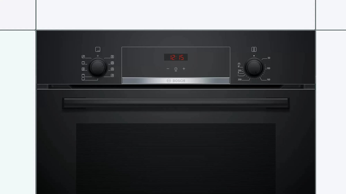 Bosch HBJ534EB0I control panel with function selector, red LED clock and temperature knob, fitted in cabinetry