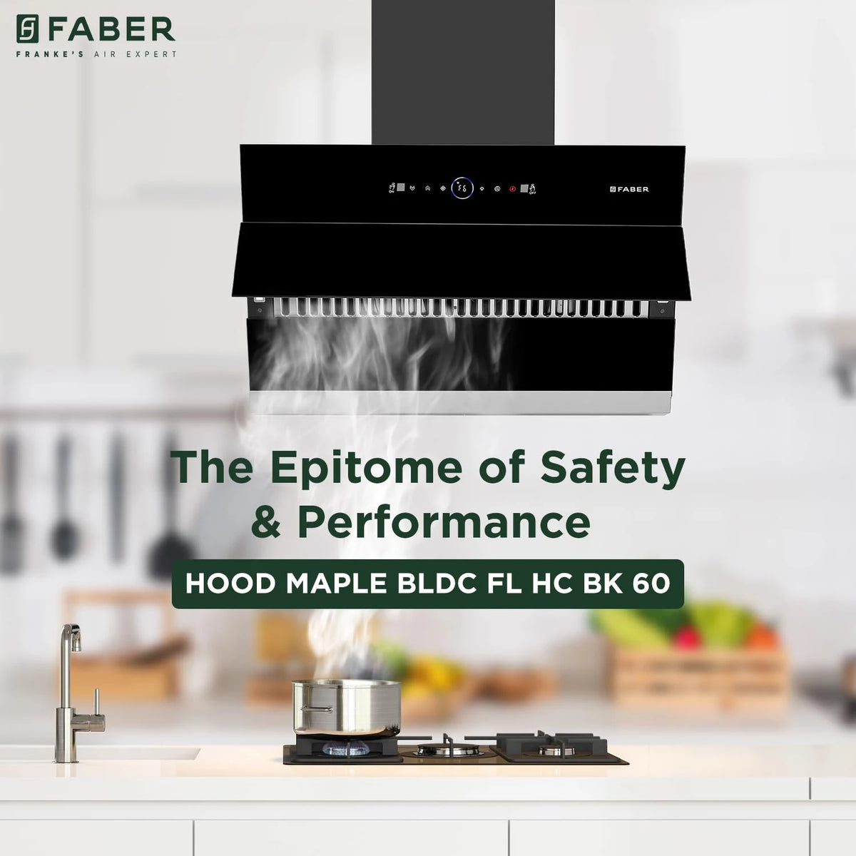 Faber Hood Maple BLDC FL HC BK 60 chimney above a gas hob with steam rising from a pot