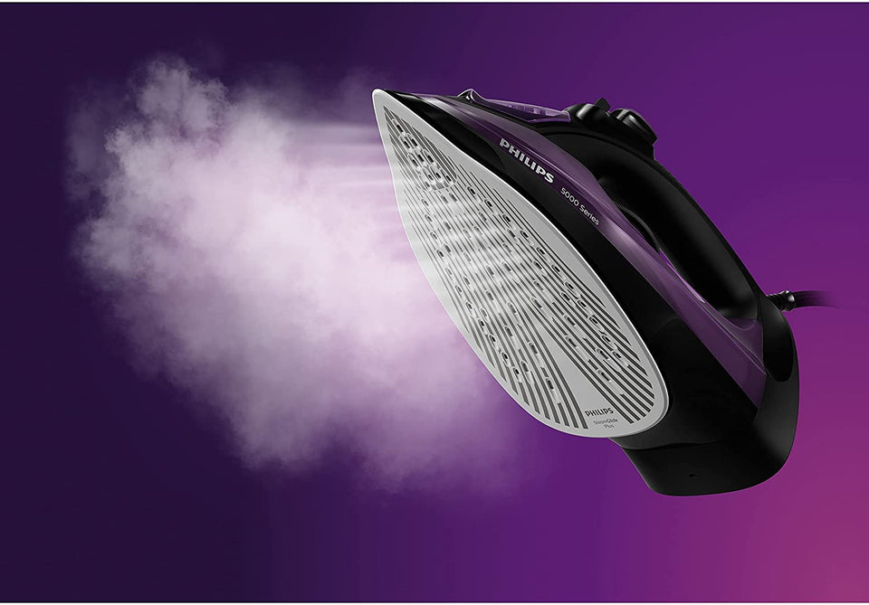 Philips DST5030/80 steam iron soleplate with a cloud of steam against a purple background