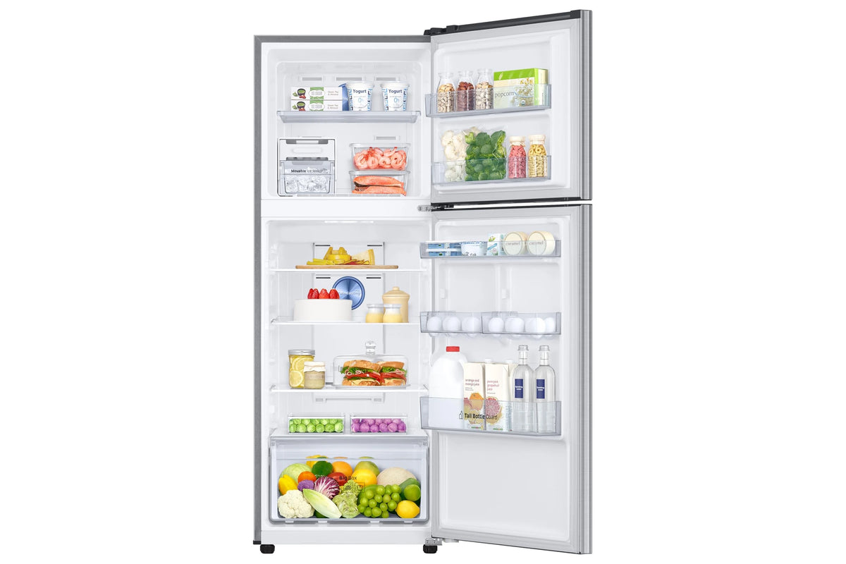 Samsung RT31H4522S8/HL with both doors open and stocked with food, showing freezer, shelves and door bins