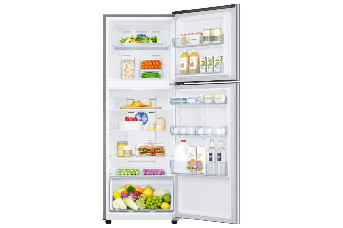 Samsung RT31H4522S8/HL open and filled with vegetables, juices, eggs and fruit across the compartments