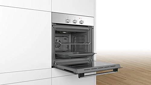 Bosch HBF011BROZ built-in oven installed in white cabinetry with door open showing the cavity, grid and pan