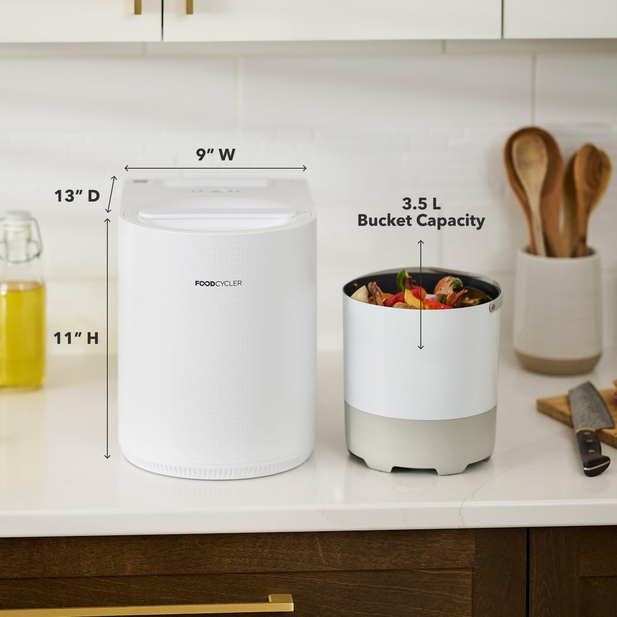 FoodCycler ECO 3 on a kitchen counter beside its 3.5 L bucket of food scraps, with 9 inch W, 13 inch D and 11 inch H dimensions