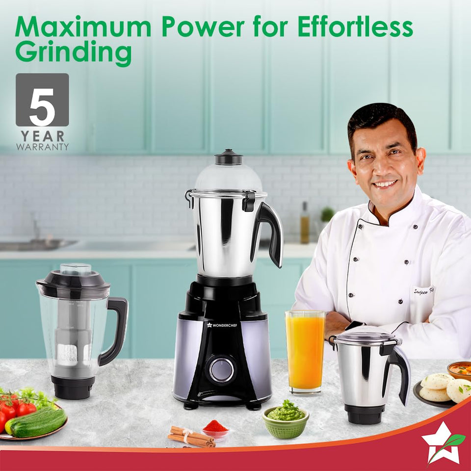 Wonderchef Galaxy 63154818 mixer grinder on a kitchen counter with jars, a glass of juice and a 5 year warranty badge