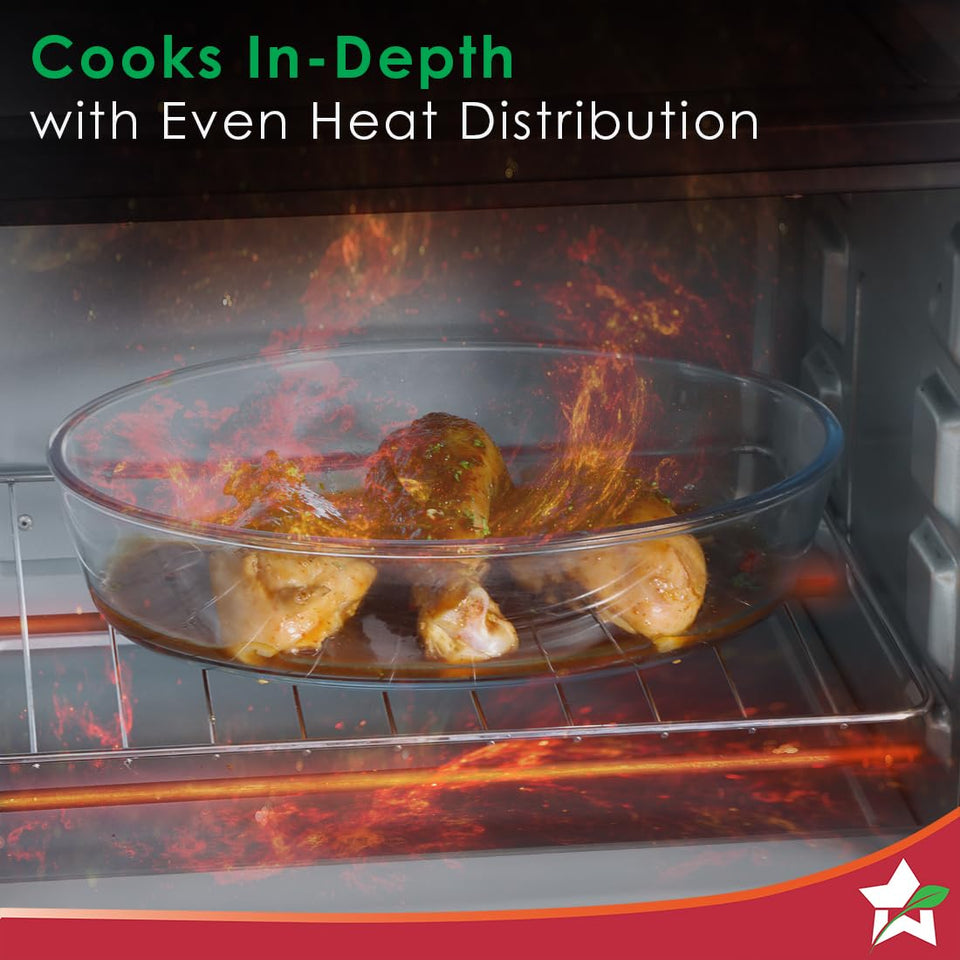 Chicken legs in a glass dish on the wire rack inside the Wonderchef 63152143 OTG with glowing heat