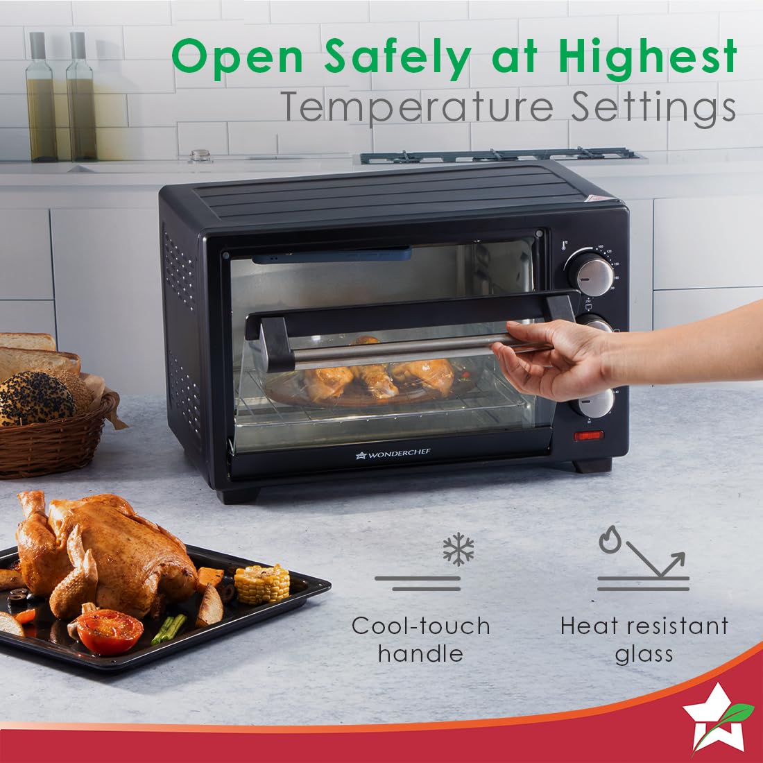 Hand opening the cool-touch handle of the Wonderchef 63152143 OTG with roast chicken inside
