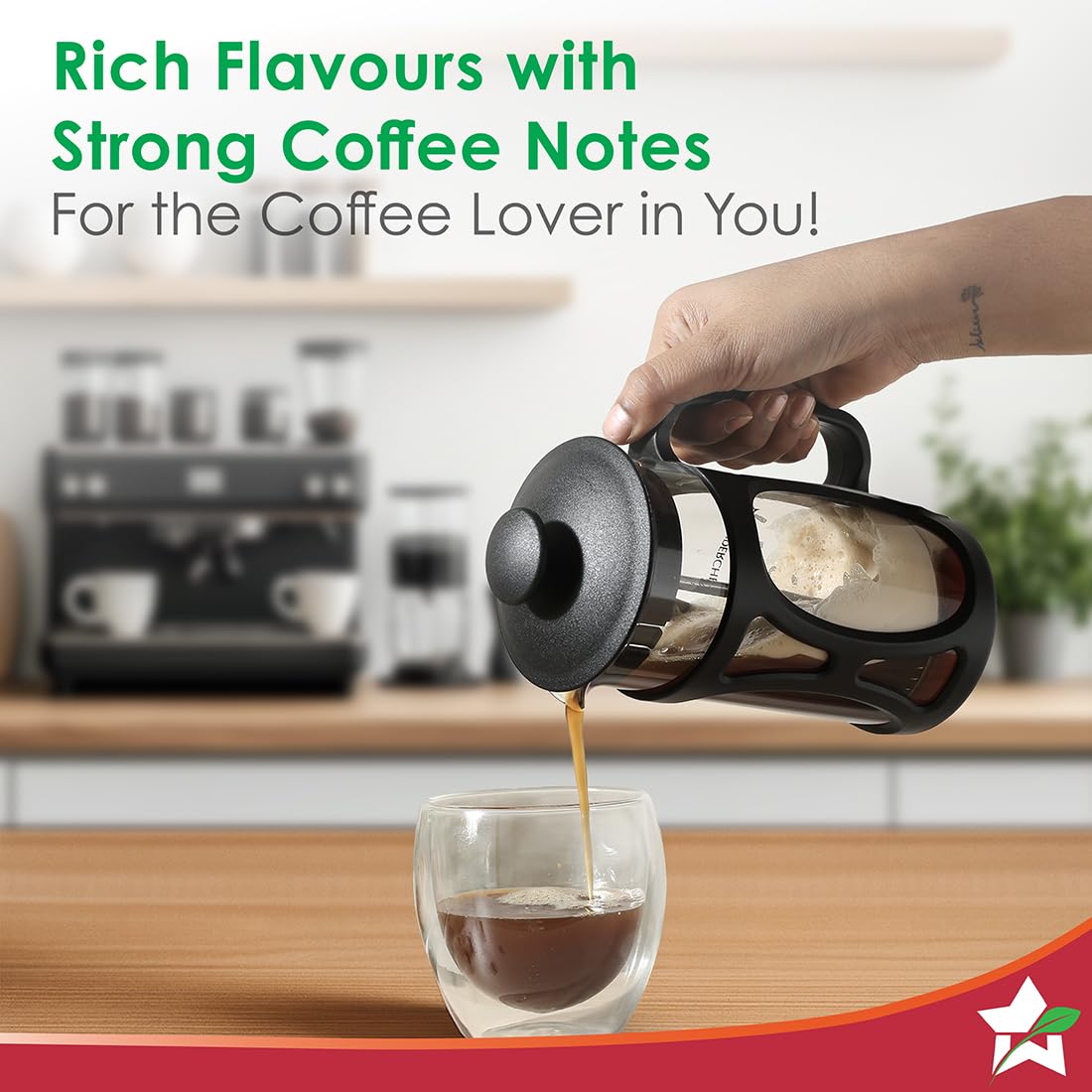 Pouring coffee from the Wonderchef 63152774 French press into a double-walled glass cup