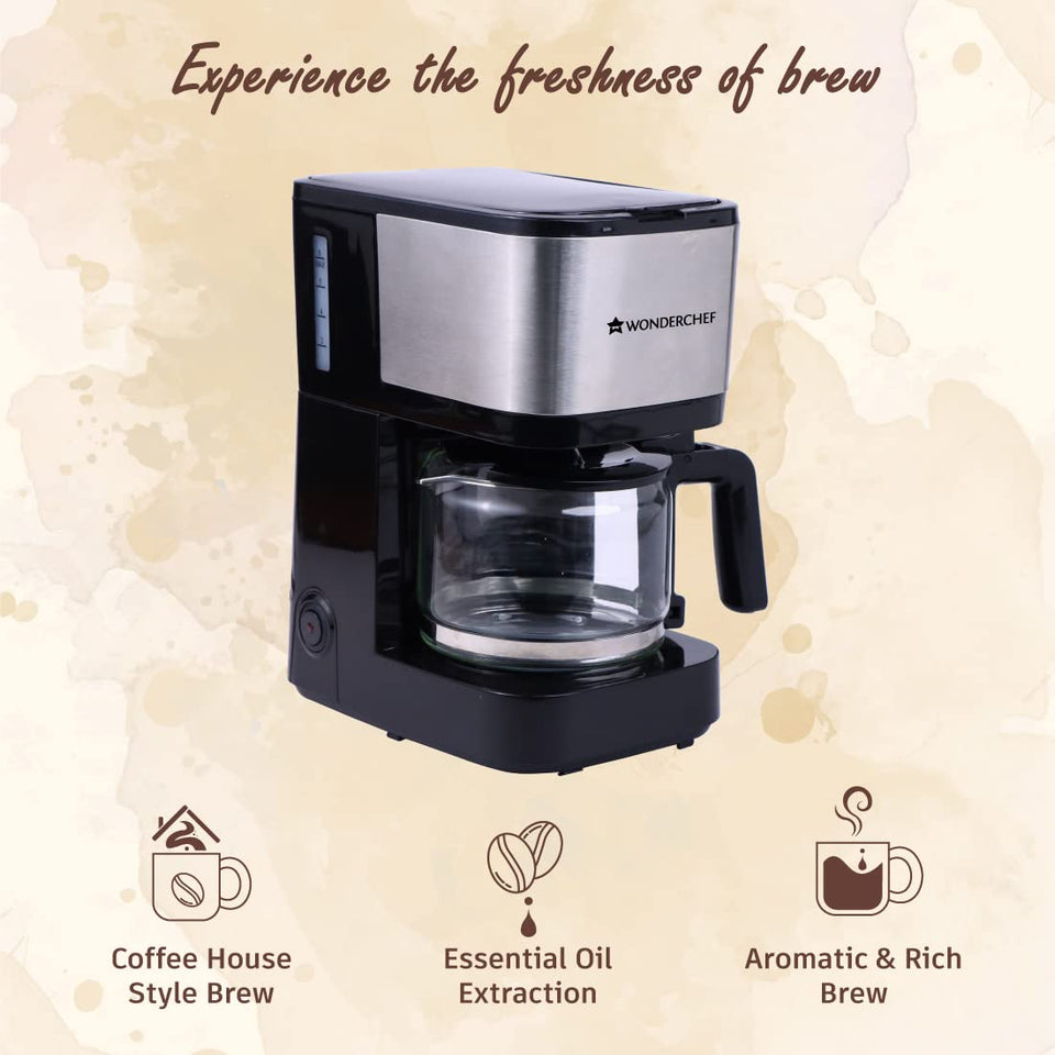 Wonderchef Regalia Pronto Brew 63154572 coffee maker with empty glass carafe and icons for coffee house style brew, essential oil extraction and aromatic rich brew