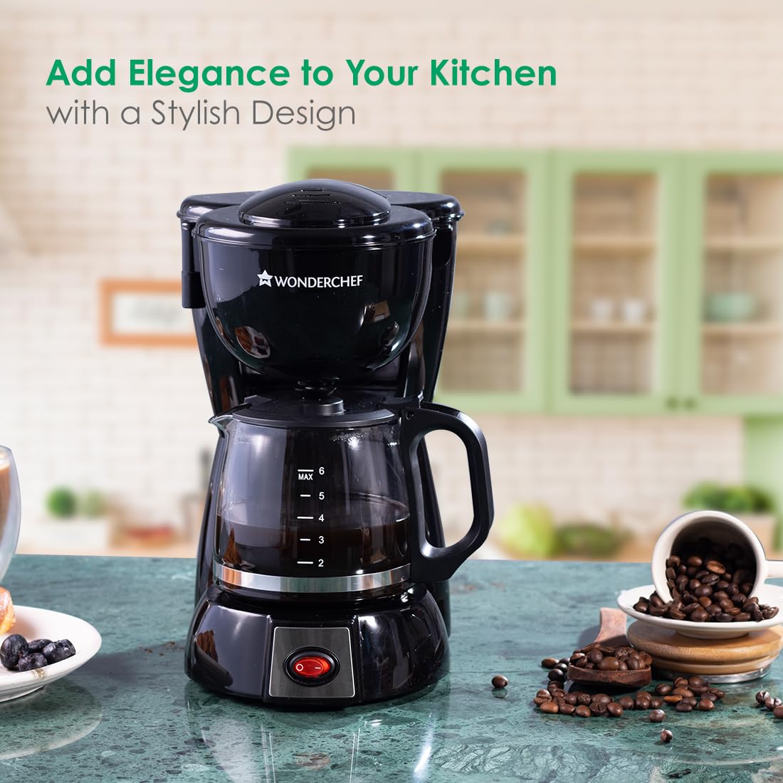 Wonderchef Onyx Brew 63154852 coffee maker with carafe on a green marble counter in a kitchen setting
