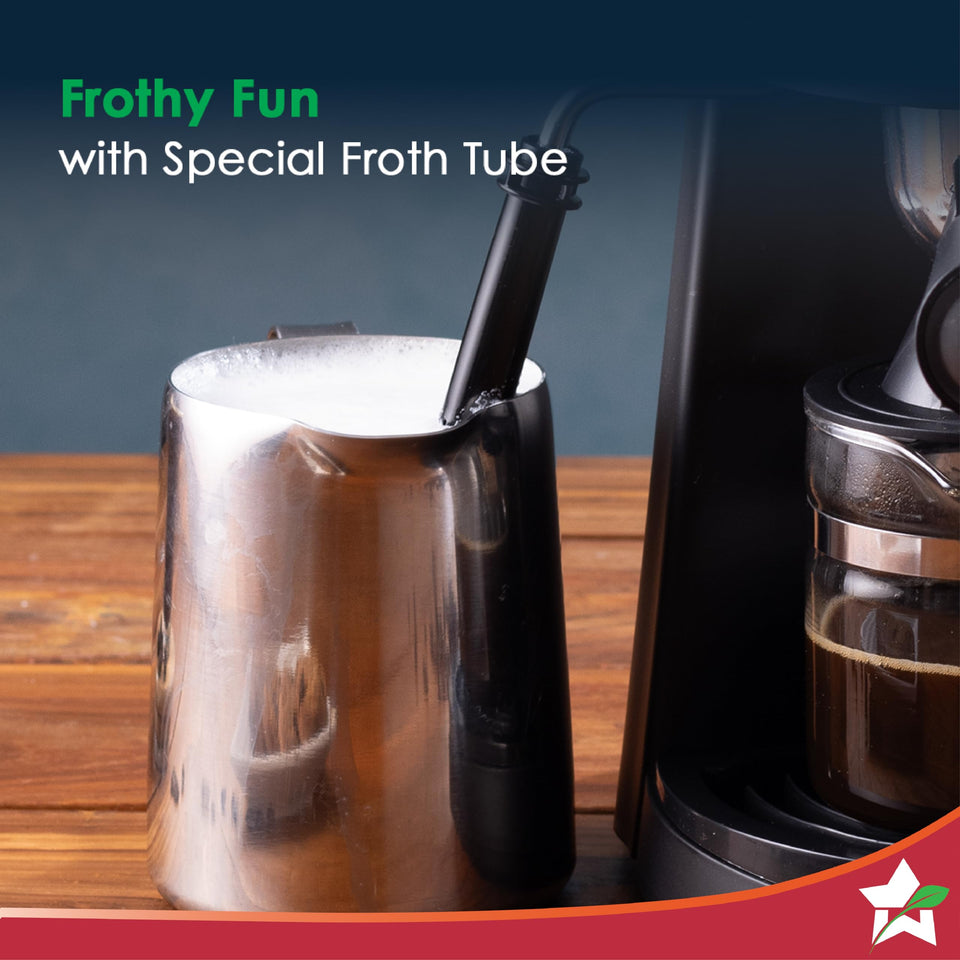 Wonderchef Regenta 63154851 steam froth tube frothing milk in a steel jug beside the glass carafe