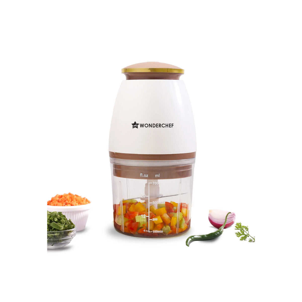 Wonderchef Nutri-Chop Pearl electric chopper in white and copper with chopped vegetables in the transparent bowl