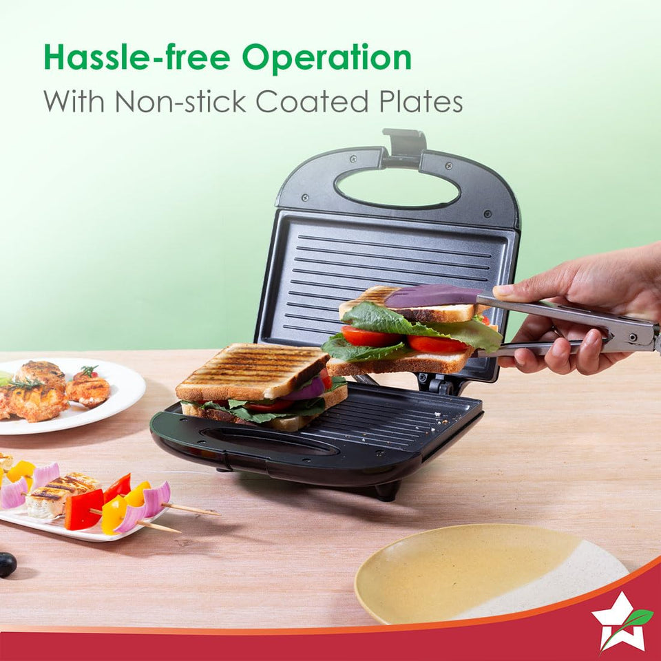 Wonderchef Prato Plus 63154445 griller with non-stick coated plates, a hand lifting a grilled sandwich with tongs