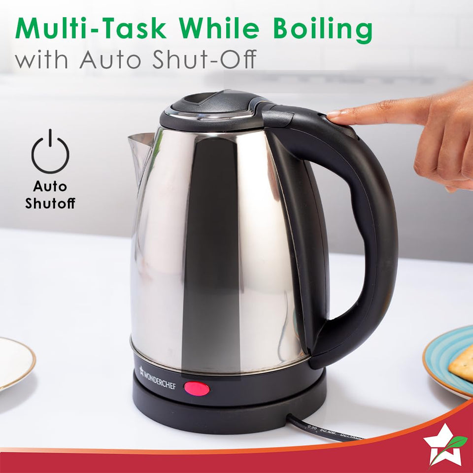 Wonderchef Crescent electric kettle with a finger on the handle switch and an auto shutoff icon