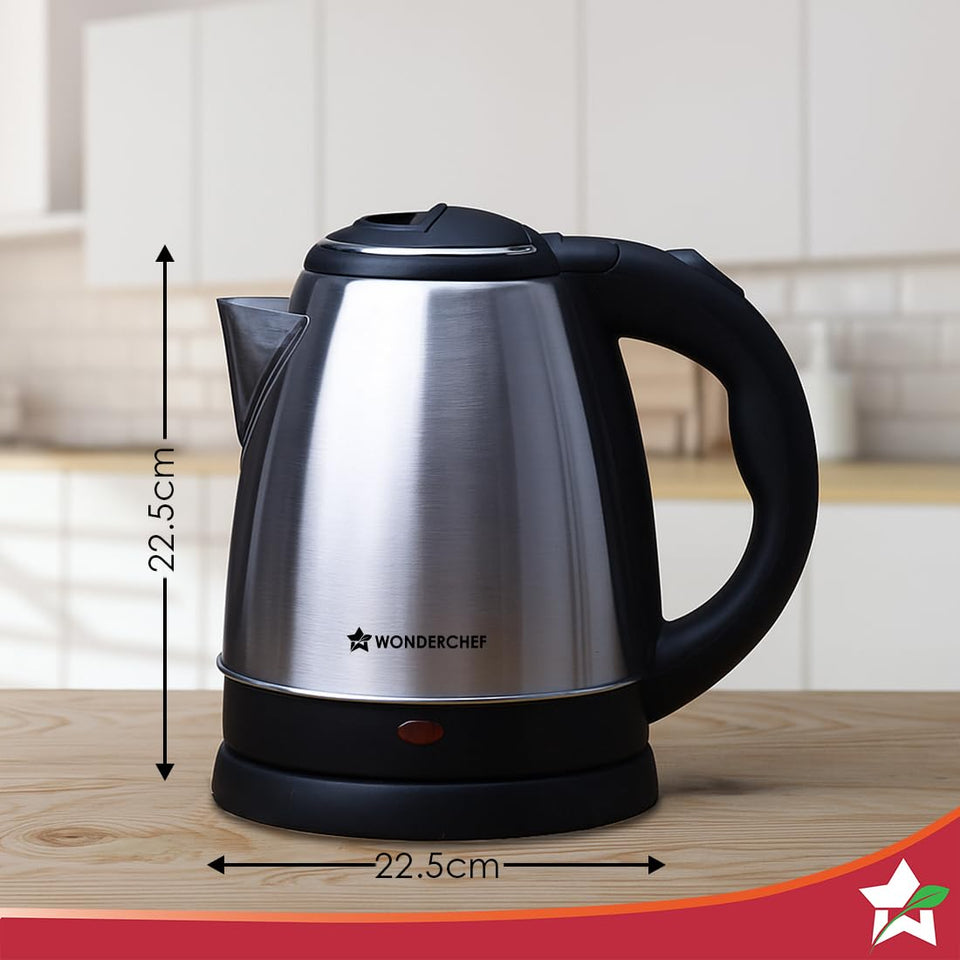 Wonderchef Crescent electric kettle on a wooden counter with 22.5 cm height and width dimension markings