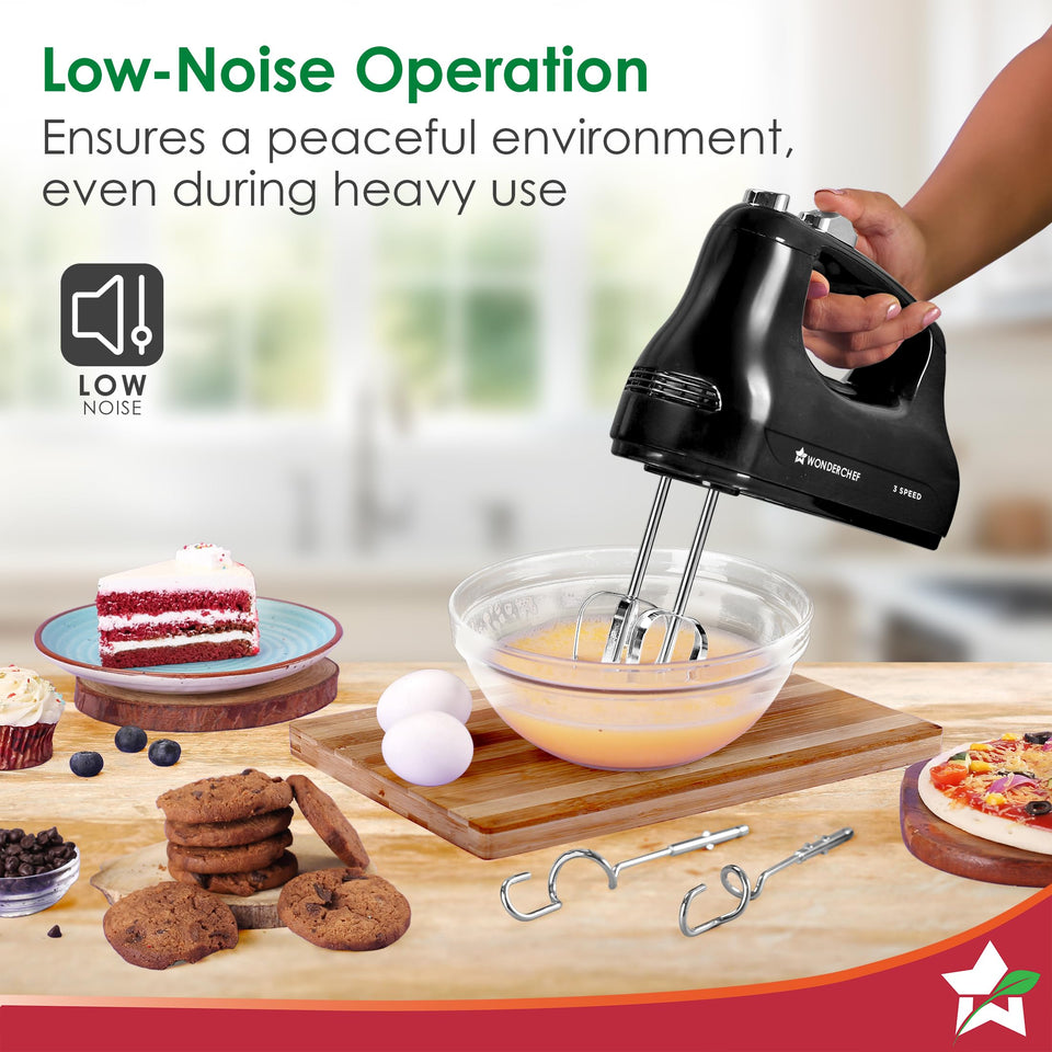 Wonderchef Essenza 63155060 hand mixer beating eggs in a glass bowl with the low-noise operation icon