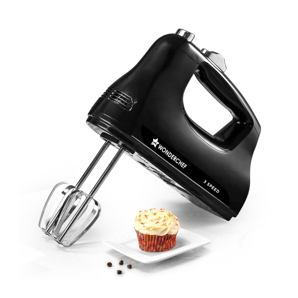 Wonderchef Essenza 63155060 black hand mixer with stainless-steel beaters beside a frosted cupcake