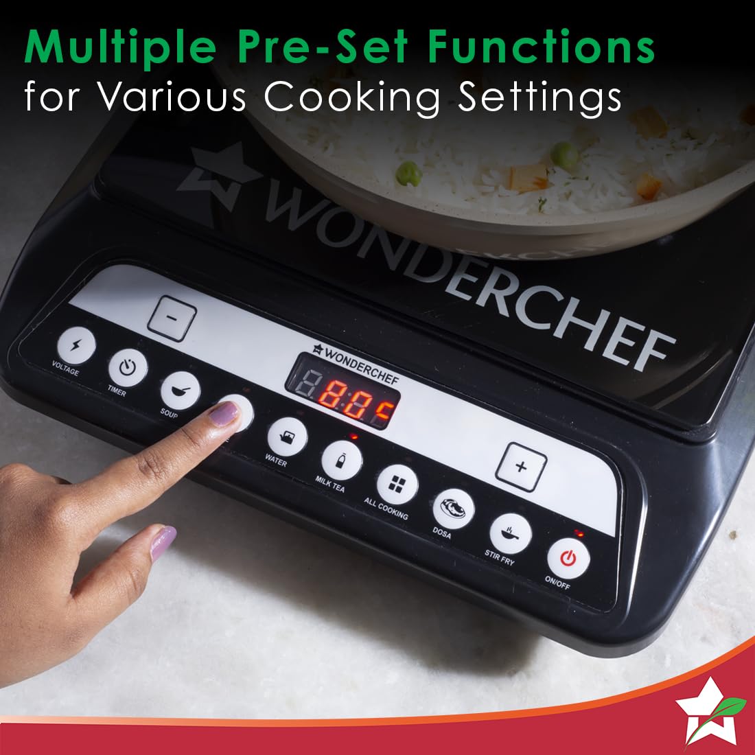 Finger pressing a preset button on the Wonderchef Power 63154814 induction cooktop with a pan of rice on top
