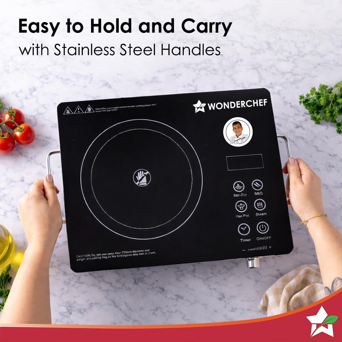 Hands carrying the Wonderchef Evita cooktop by its stainless steel side handles