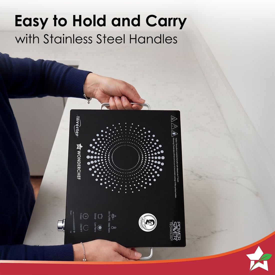 Person carrying the Wonderchef Smart Cook infrared cooktop by its stainless steel side handles