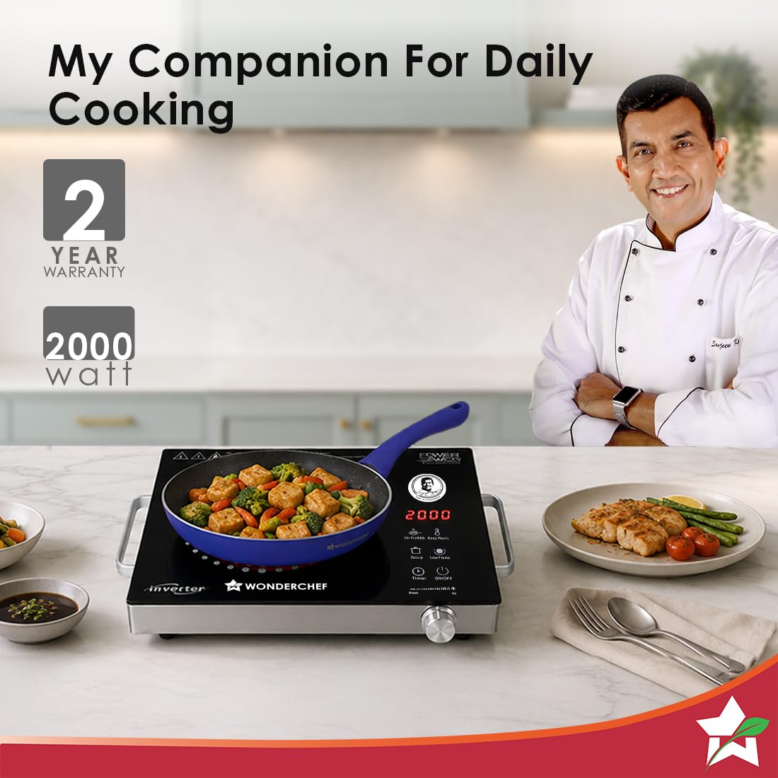 Wonderchef Smart Cook 2000W infrared electric cooktop with a frying pan of vegetables and paneer on a kitchen counter, with 2-year warranty and 2000 watt callouts