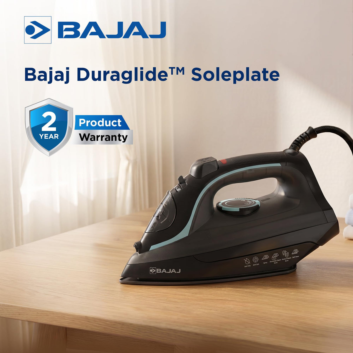 Bajaj MX 45 steam iron on a wooden table with a 2 year product warranty badge and Duraglide soleplate heading