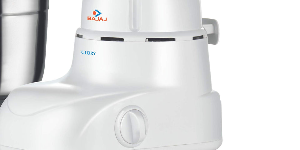 Close-up of the Bajaj Glory mixer grinder white motor base showing the Glory name and control knob