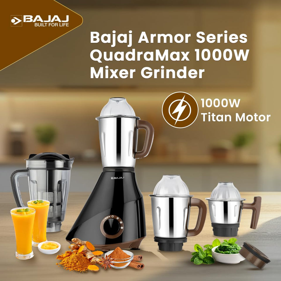 Bajaj 410635 Armor Series QuadraMax 1000W mixer grinder with jars, mango juice glasses and spices on a kitchen counter