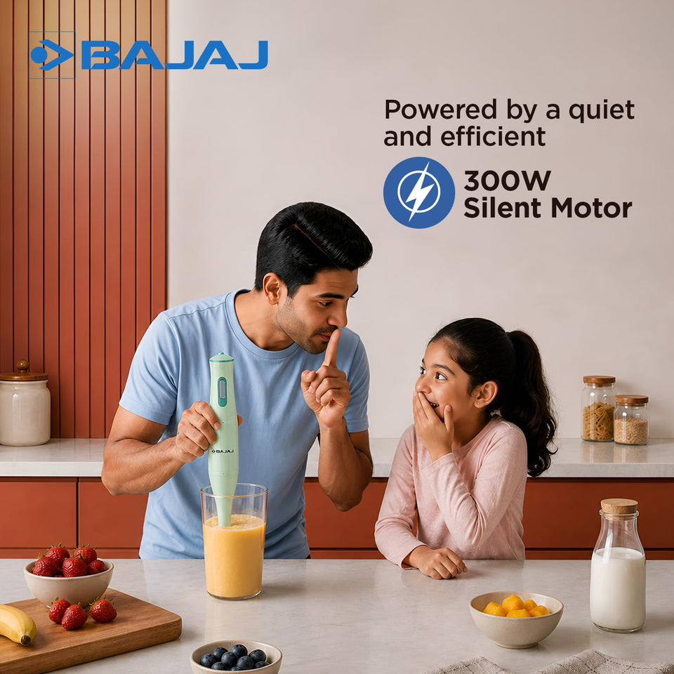 Man blending a fruit drink with the Bajaj HB 20 hand blender, highlighting the 300W silent motor