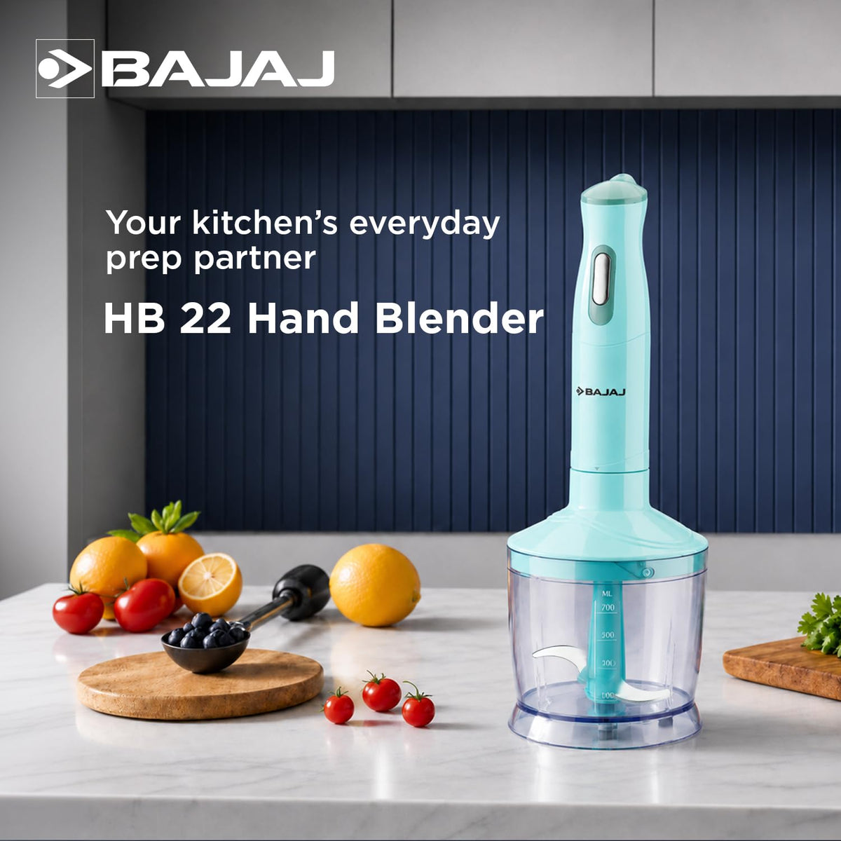 Bajaj HB 22 hand blender with chopping bowl on a marble kitchen counter beside fruit and tomatoes