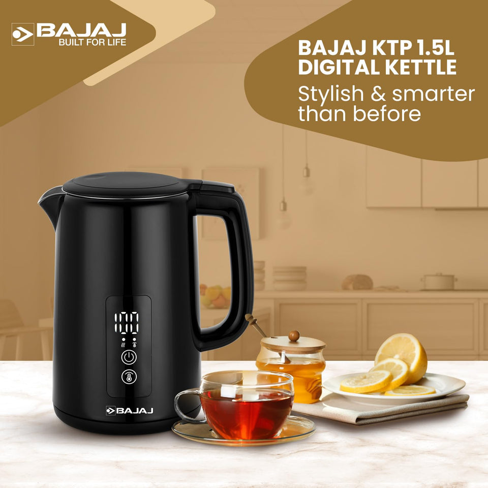 Bajaj KTP 1.5 Digital kettle on a kitchen counter beside a cup of tea, honey jar and sliced lemon