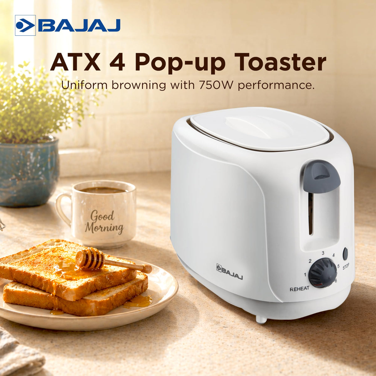 Bajaj ATX 4 pop-up toaster with dust cover on a kitchen counter beside honey toast and a Good Morning mug