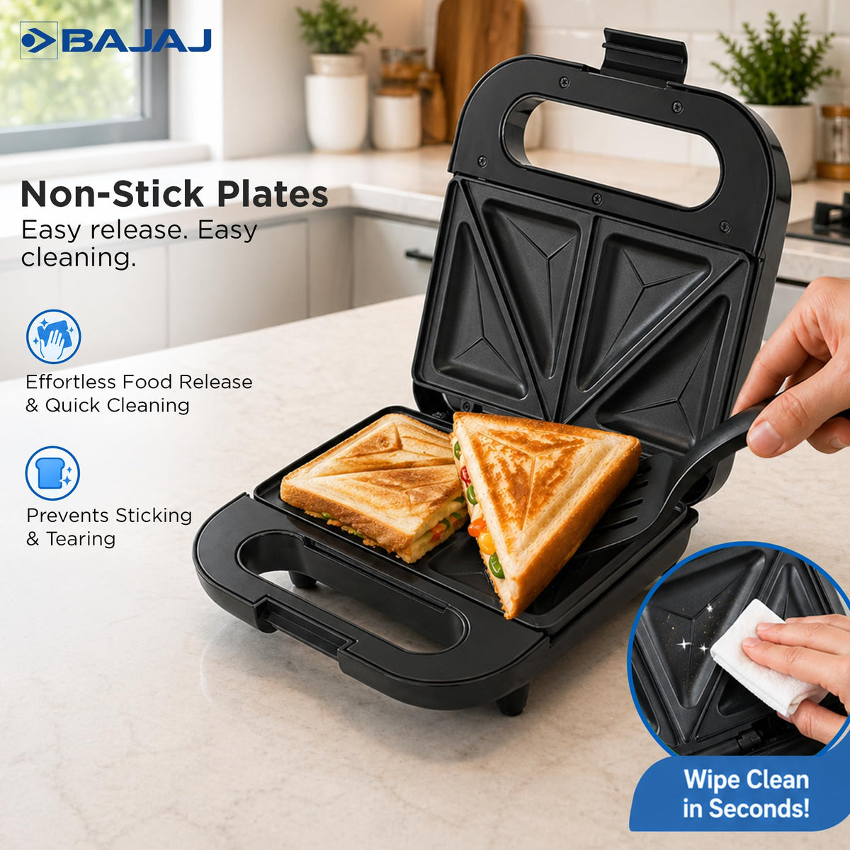 Bajaj SWX 5 non-stick plates with a toasted sandwich being lifted out and a hand wiping the plate clean
