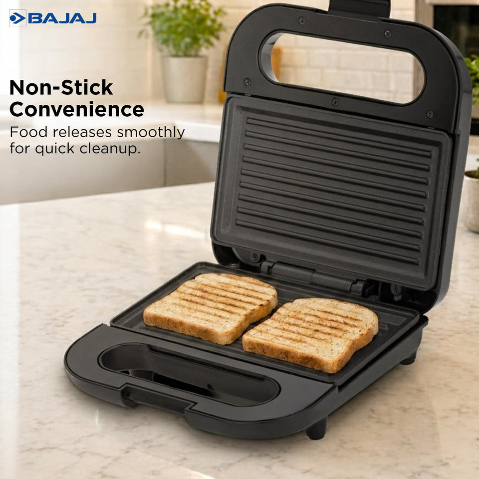 Bajaj SWX 6 sandwich griller with two grilled bread slices on its non-stick ribbed plates