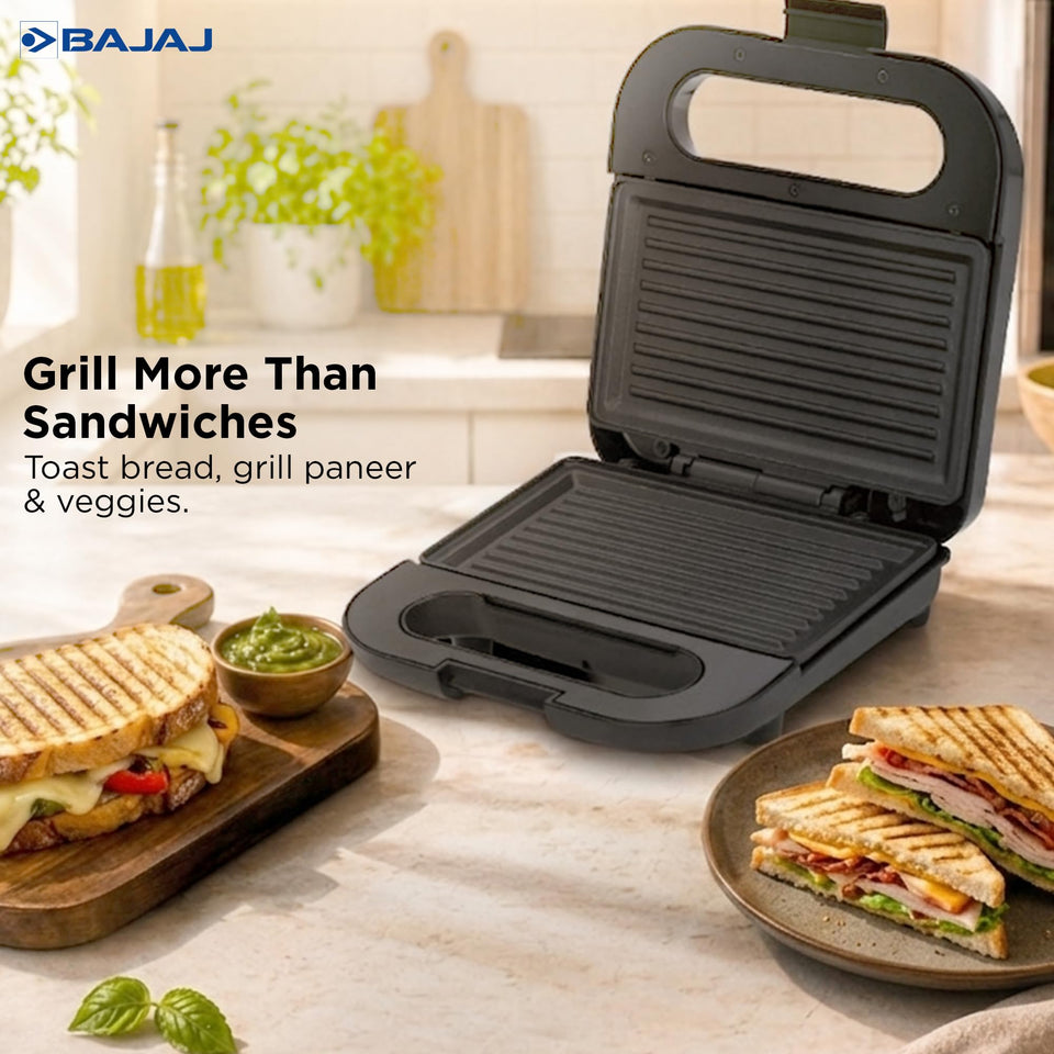 Bajaj SWX 6 sandwich griller open on a kitchen counter beside grilled sandwiches, with the text Grill More Than Sandwiches