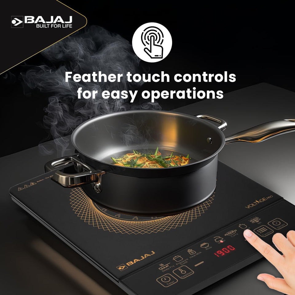 Bajaj ICX 190FS induction stove with a steel pan and a finger pressing the feather touch controls