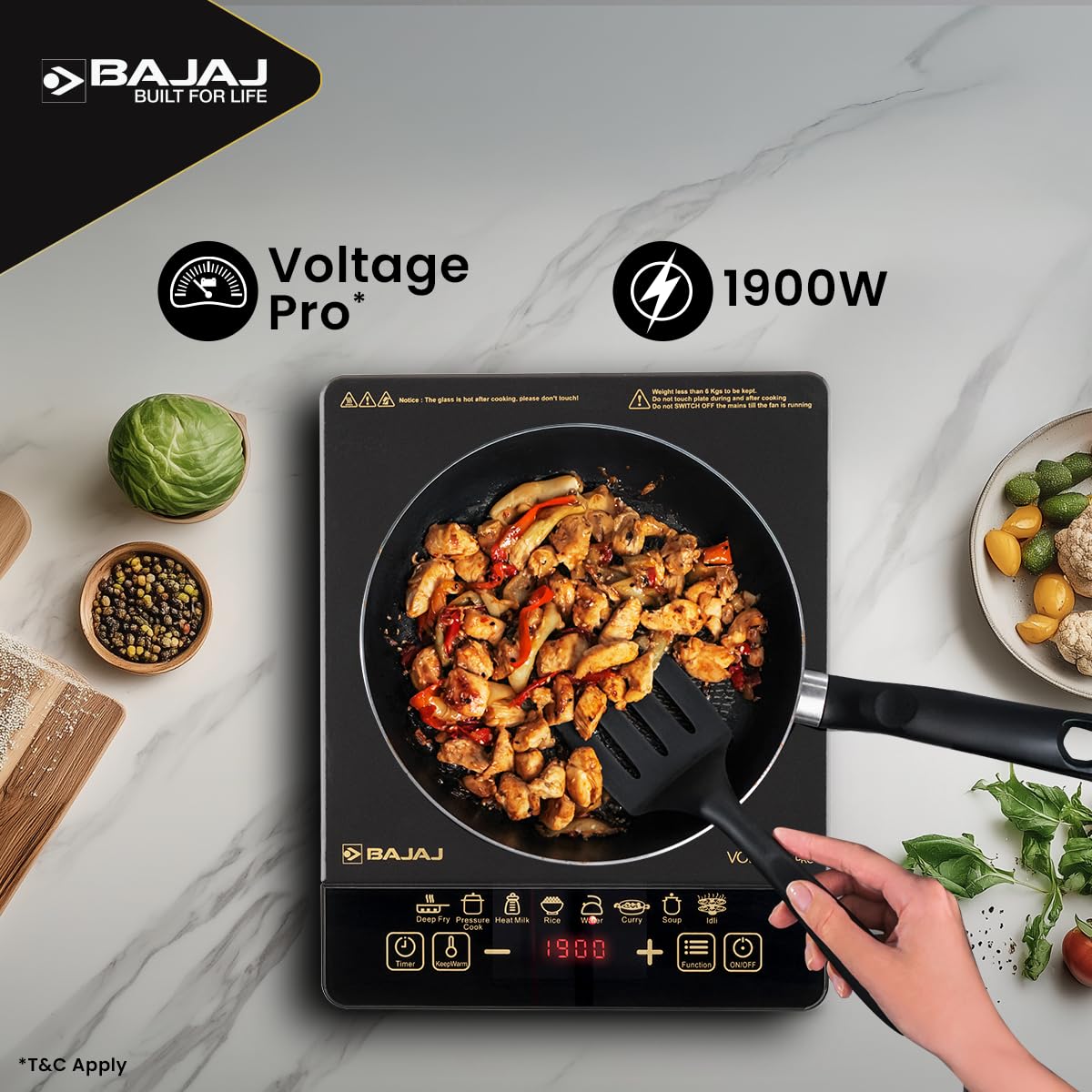 Bajaj ICX 190FS induction stove with a pan of stir-fried chicken and vegetables, with Voltage Pro and 1900W callouts