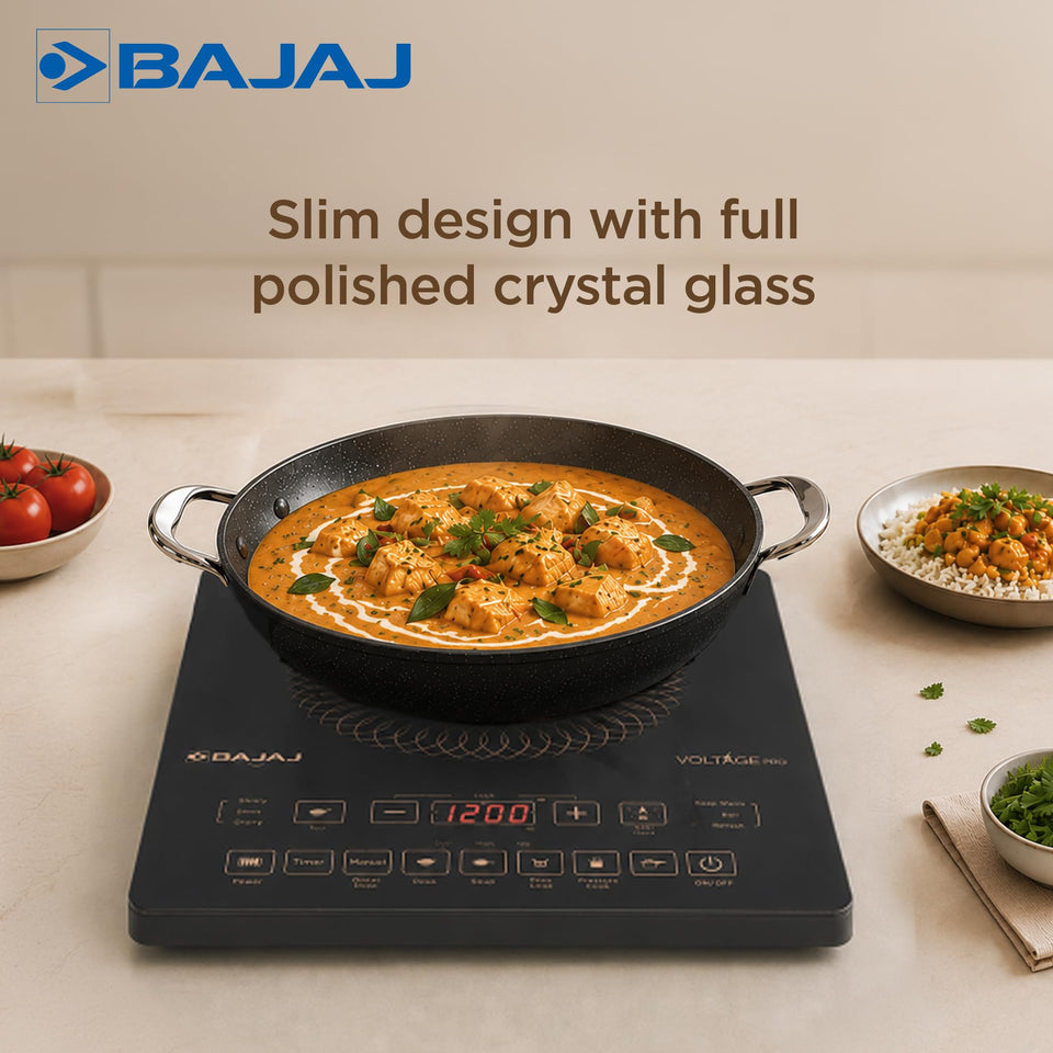 Bajaj ICX 200FP induction cooktop with a kadai of paneer curry highlighting the slim polished crystal glass design
