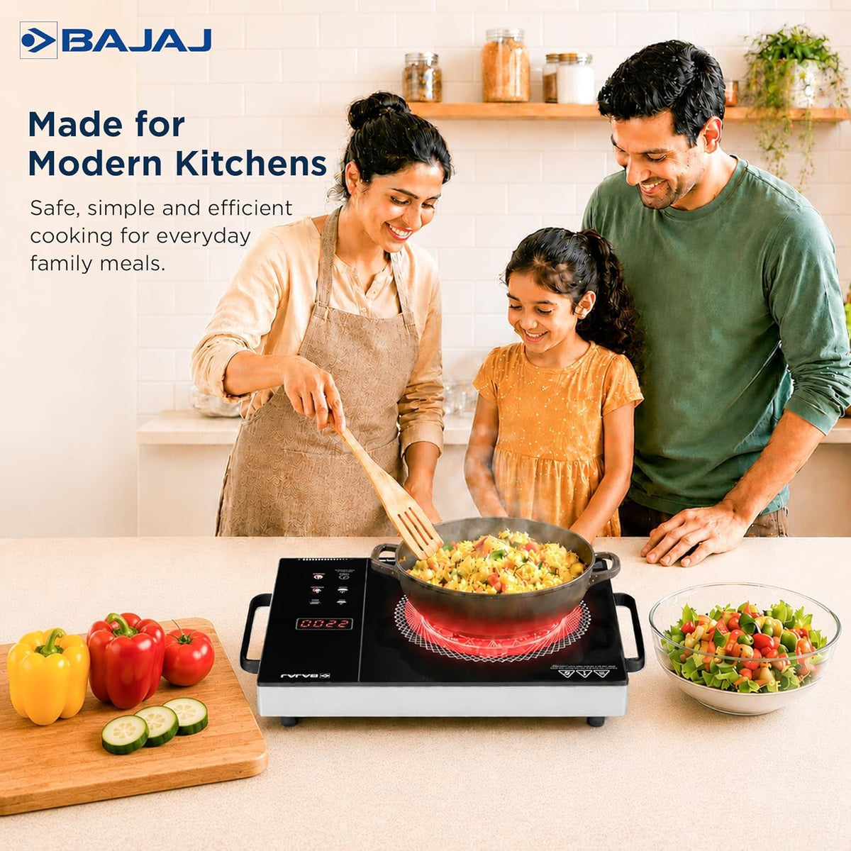 Family cooking rice in a pan on the Bajaj IRX 220F infrared cooktop on a kitchen counter, with the heating zone glowing red