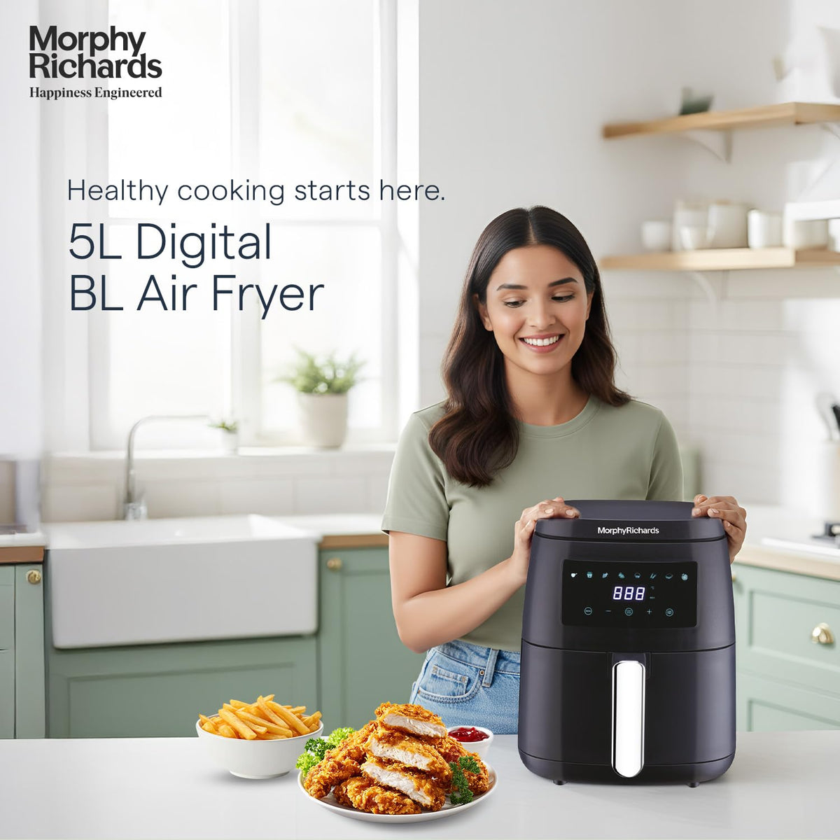 Morphy Richards 510056 5 L digital air fryer on a kitchen counter with fries and crumbed chicken beside it