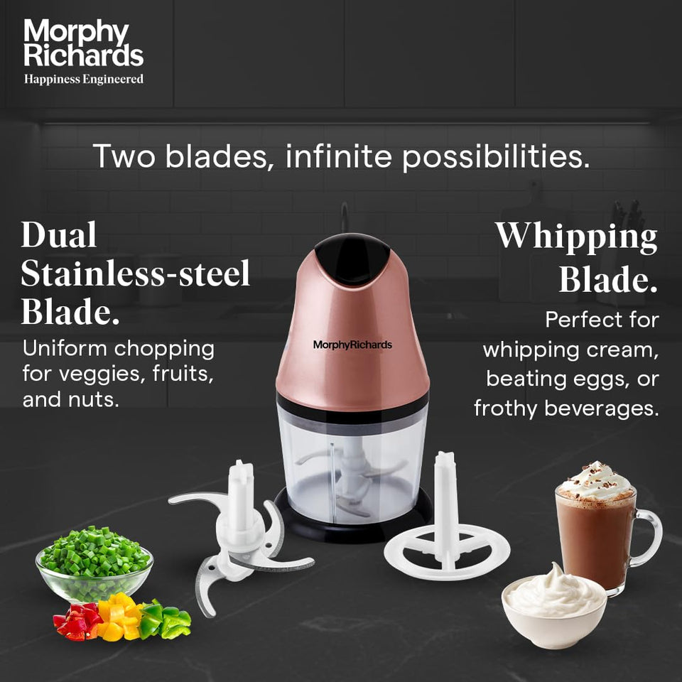 Morphy Richards 640082 mini chopper with its stainless steel chopping blade and whipping blade attachment beside chopped vegetables and cream