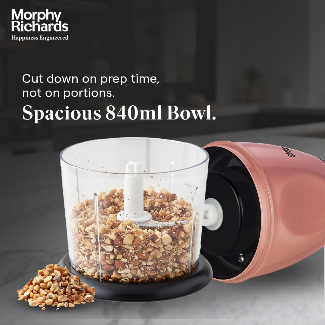 Morphy Richards 640082 mini chopper bowl filled with chopped nuts with the motor unit lifted off, showing the 840 ml bowl
