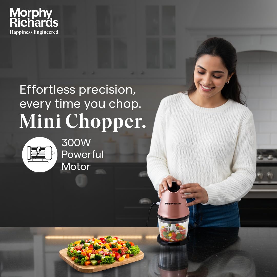 Woman using the Morphy Richards 640082 mini chopper in a kitchen with a 300W powerful motor callout and chopped salad