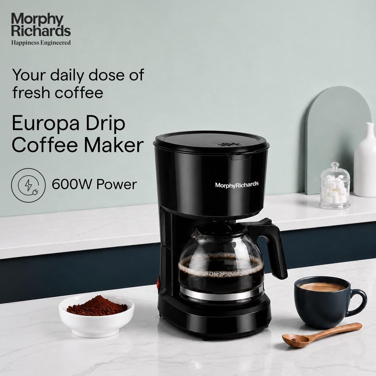 Morphy Richards 350012 Europa Drip coffee maker on a kitchen counter with brewed coffee, 600W Power callout