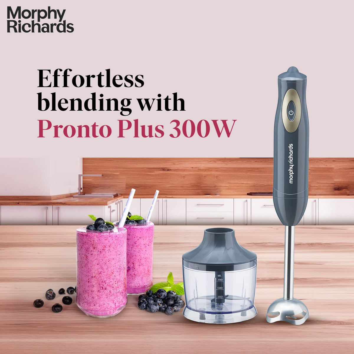 Morphy Richards Pronto Plus 300W hand blender with chopper bowl on a kitchen counter beside berry smoothies