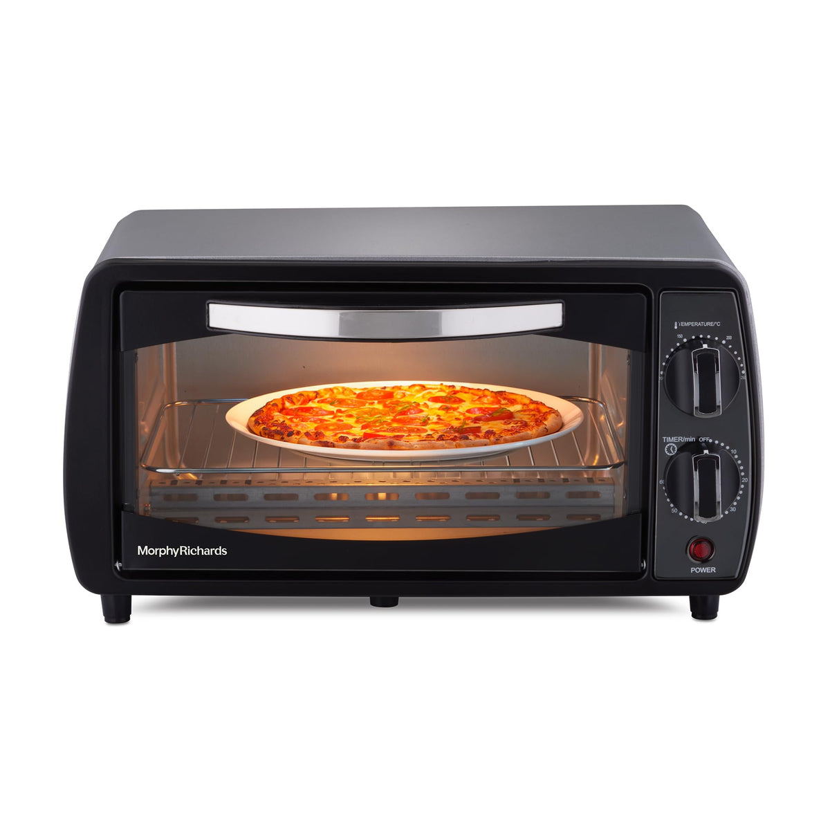 Front view of the Morphy Richards 510065 10 L OTG oven with a pizza on the wire rack and temperature and timer knobs on the right