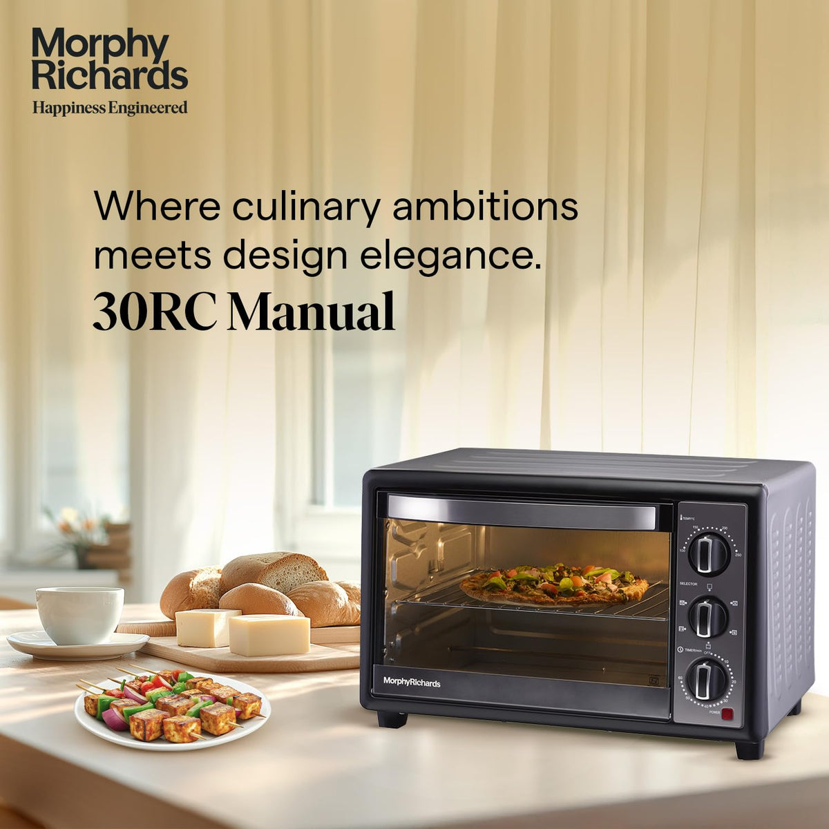 Morphy Richards 510070 30 RC Manual OTG on a kitchen counter with bread, cheese and paneer tikka skewers