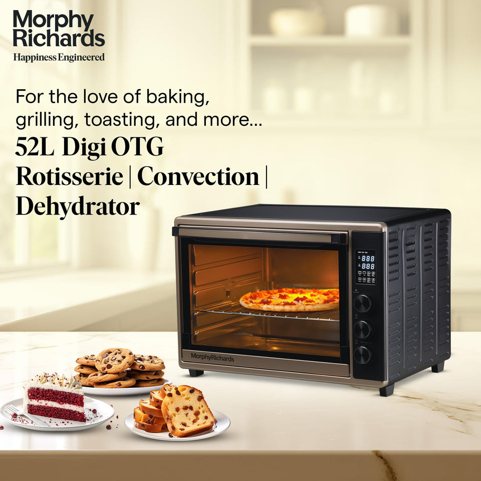 Morphy Richards 52RCD Digi 52 L OTG on a kitchen counter with pizza, cookies, cake and fruit bread, labelled rotisserie, convection and dehydrator